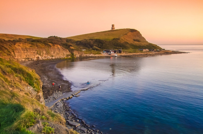 Kimmeridge Bay during the summer with very calm waters.