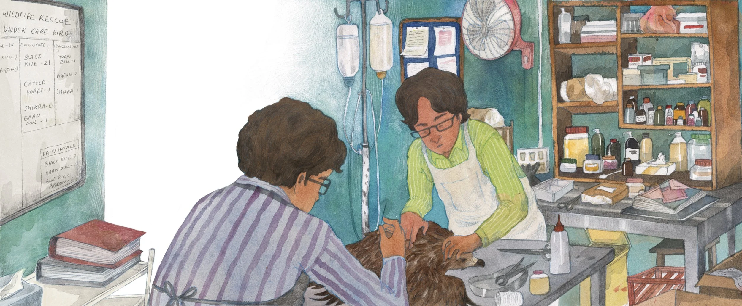 Two people, one with glasses, are attending to a large furry animal on a metal table in a veterinary clinic or animal rescue facility, with medical supplies and shelves in the background.