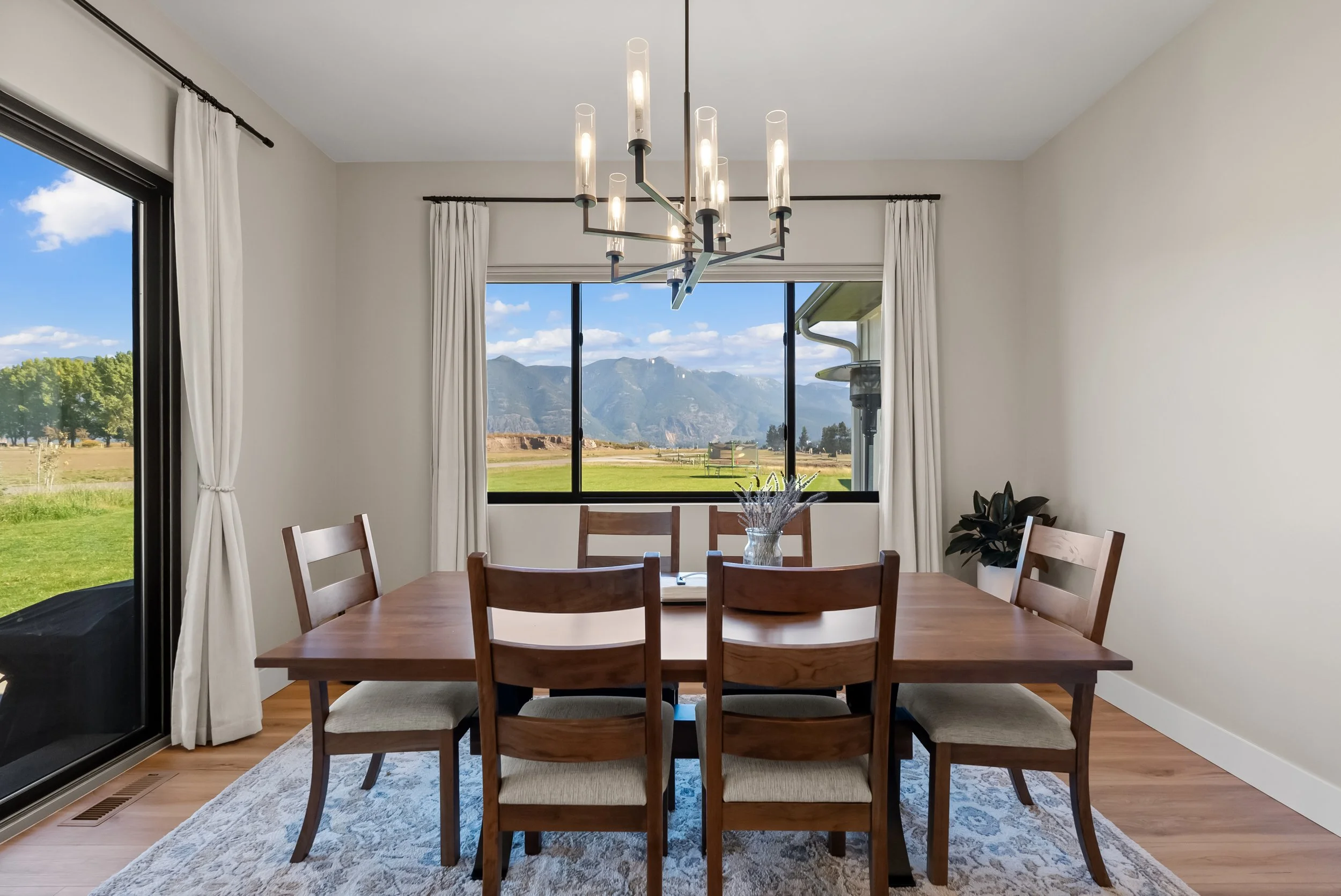 Dinning Room with mountain view with stain wood table