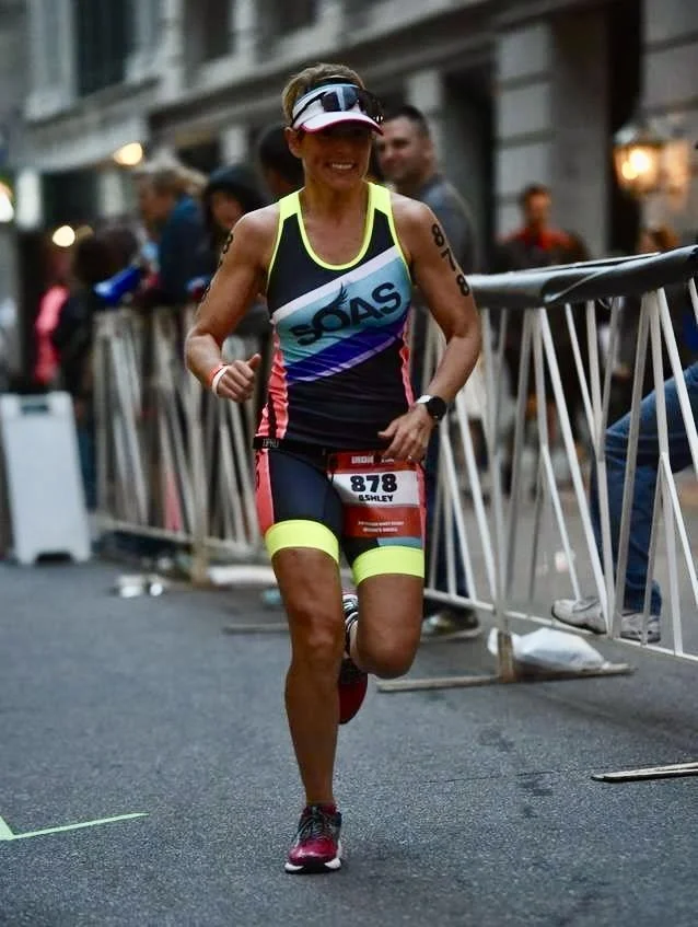 triathlete runner woman racing ironman marathon