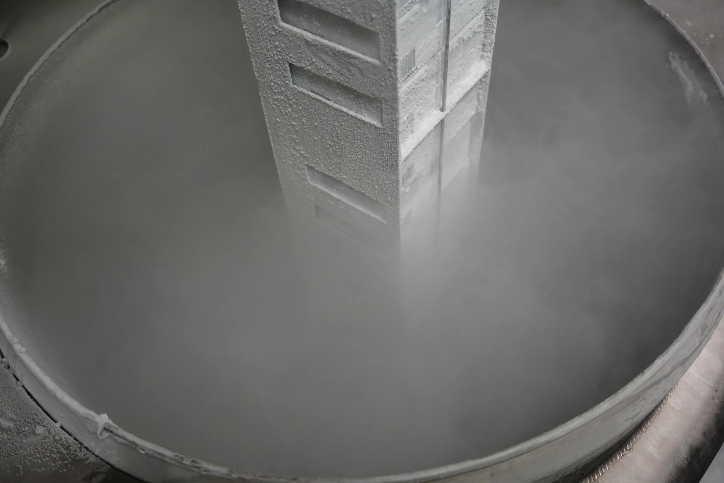 A large cryogenic tank filled with liquid nitrogen. Pulling inventory rack from tank