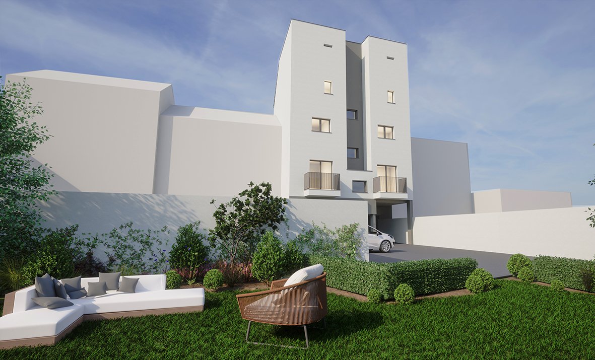 Vista de un edificio moderno de varios pisos, con un área de jardín en primer plano con mobiliario y arbustos verdes.