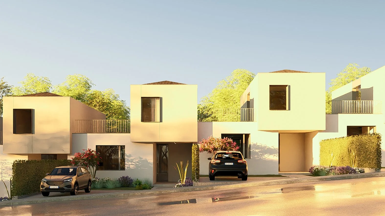 Casa moderna de dos pisos con ventanas grandes, garage, y autos estacionados en una calle, rodeada de plantas y árboles en un día soleado.