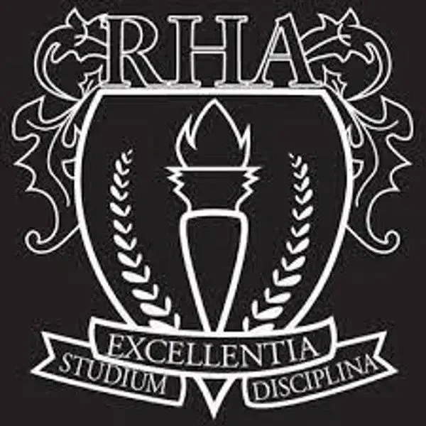A black and white emblem featuring a torch at the center with laurel branches, a shield outline, and the words 'RHAC,' 'EXCELLENTIA,' 'STUDIUM,' and 'DISCIPLINA'.