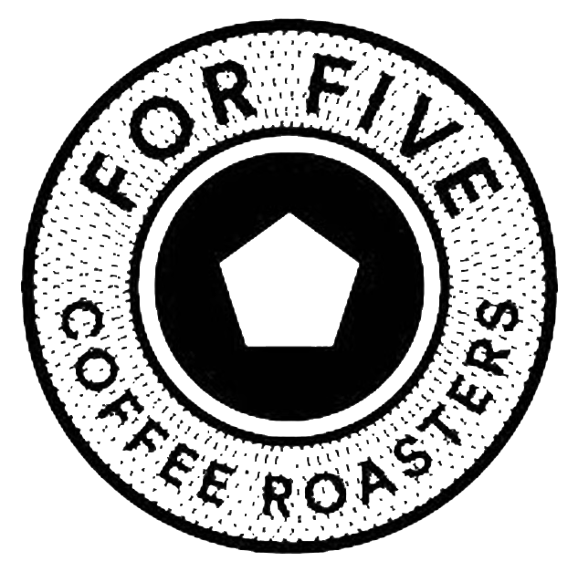 A black circular emblem with the text 'PORTFOLIO' at the top and 'COFFEE ROASTERS' at the bottom. In the center, there is a pentagon-shaped graphic.