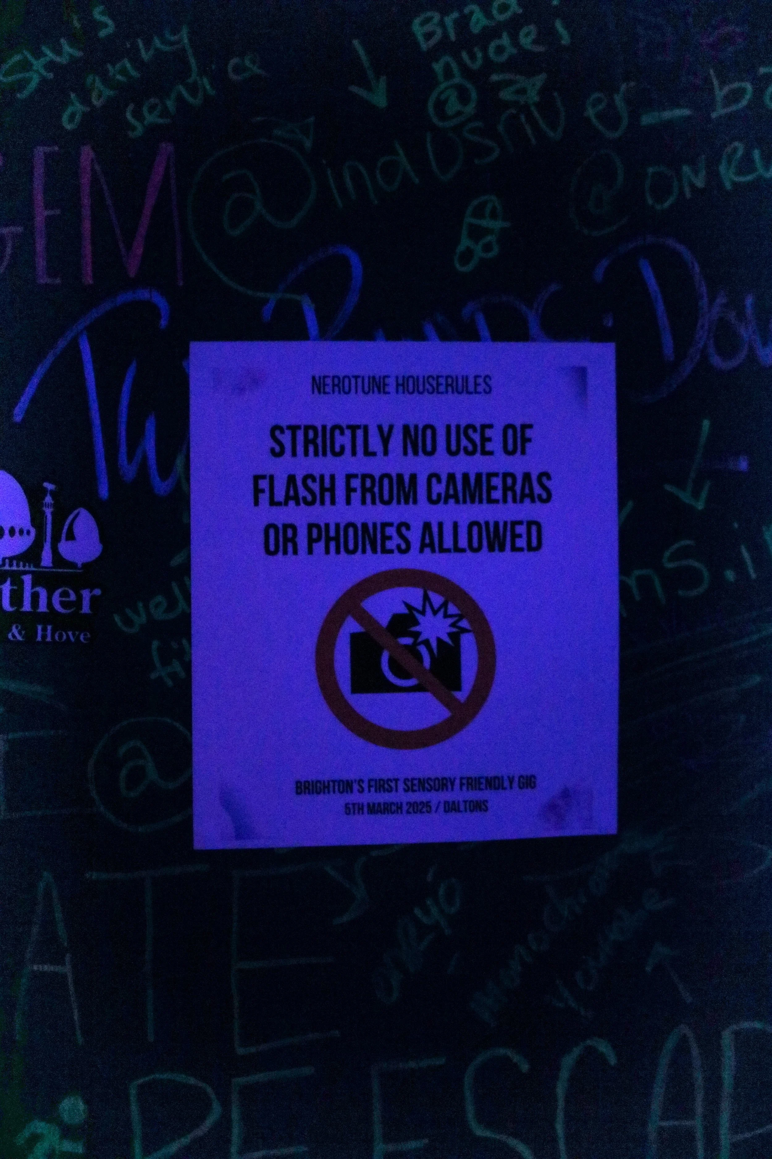 No flash photography warning at a sensory friendly gig.