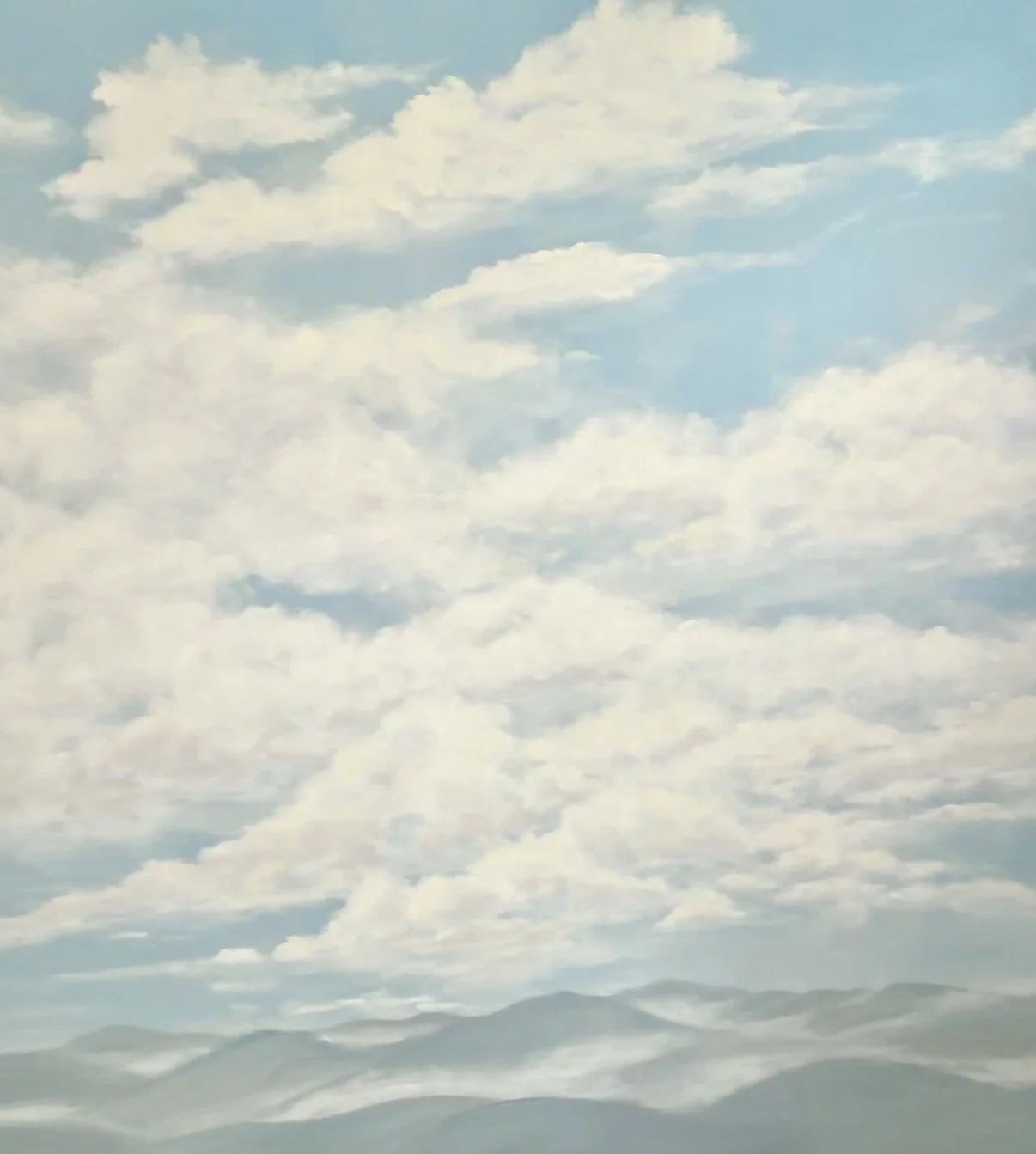 A hand-painted mural of a scenic view of a cloudy sky over mountains.