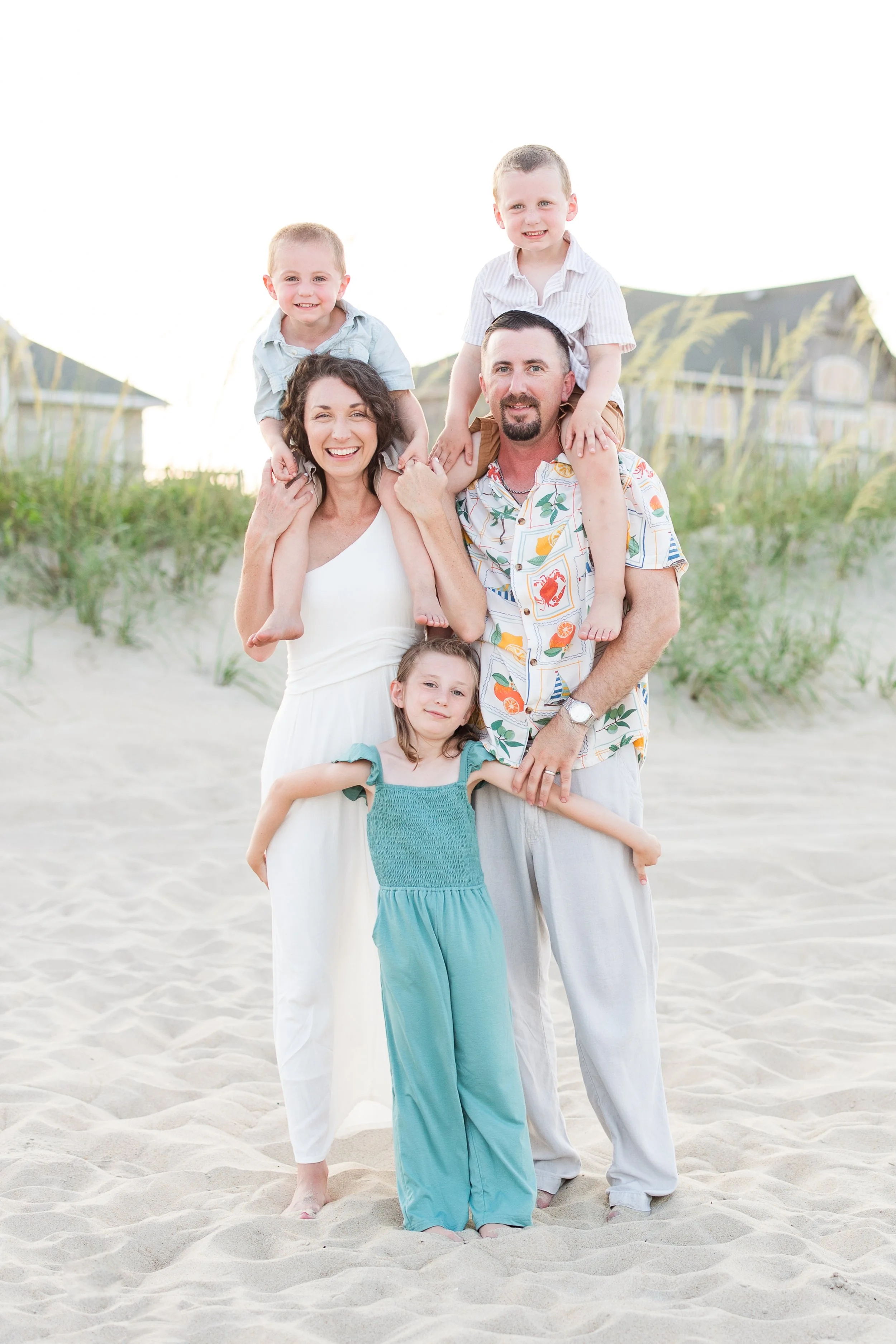 A family of five enjoying a beach day