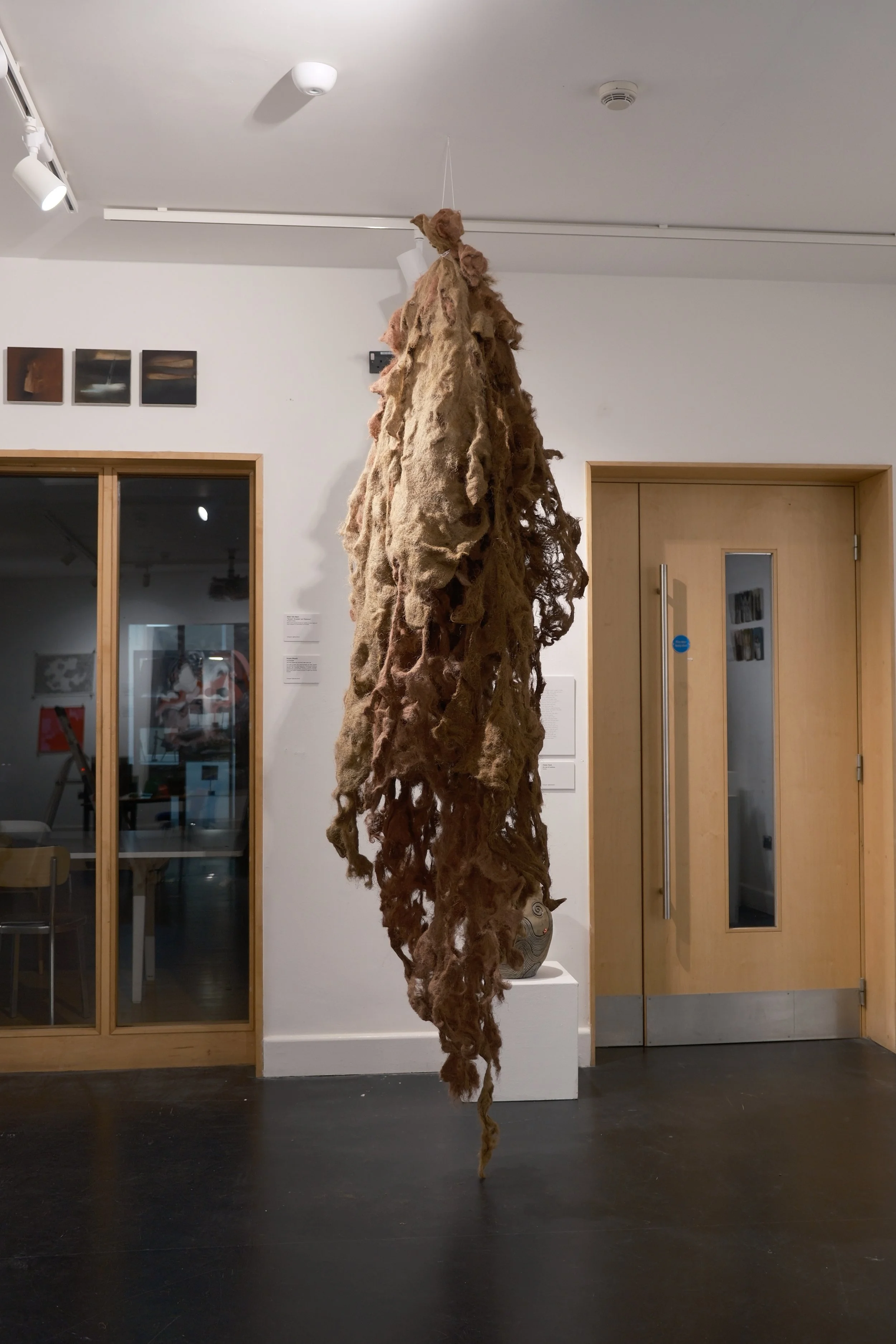 Connected, 2025. Jute liner, forged clay, red ochre, fuller earth, oils- 7 X 3 ft