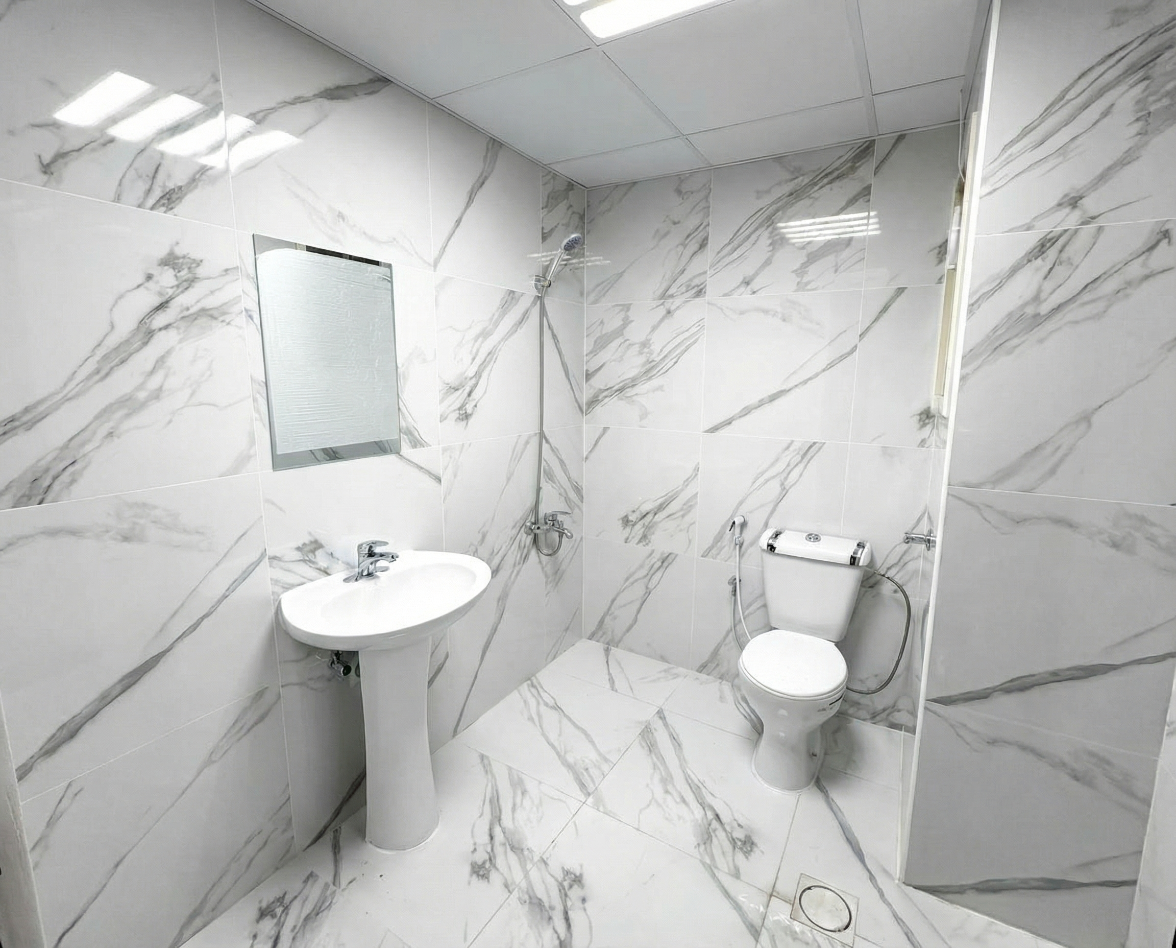 Clean Tiled Washrooms and Toilets at NDYT Labor Camp