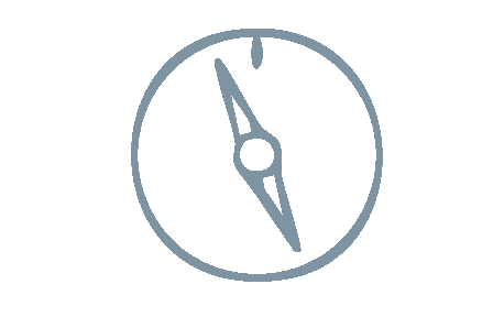 Close-up of a compass showing north at the top and south at the bottom.