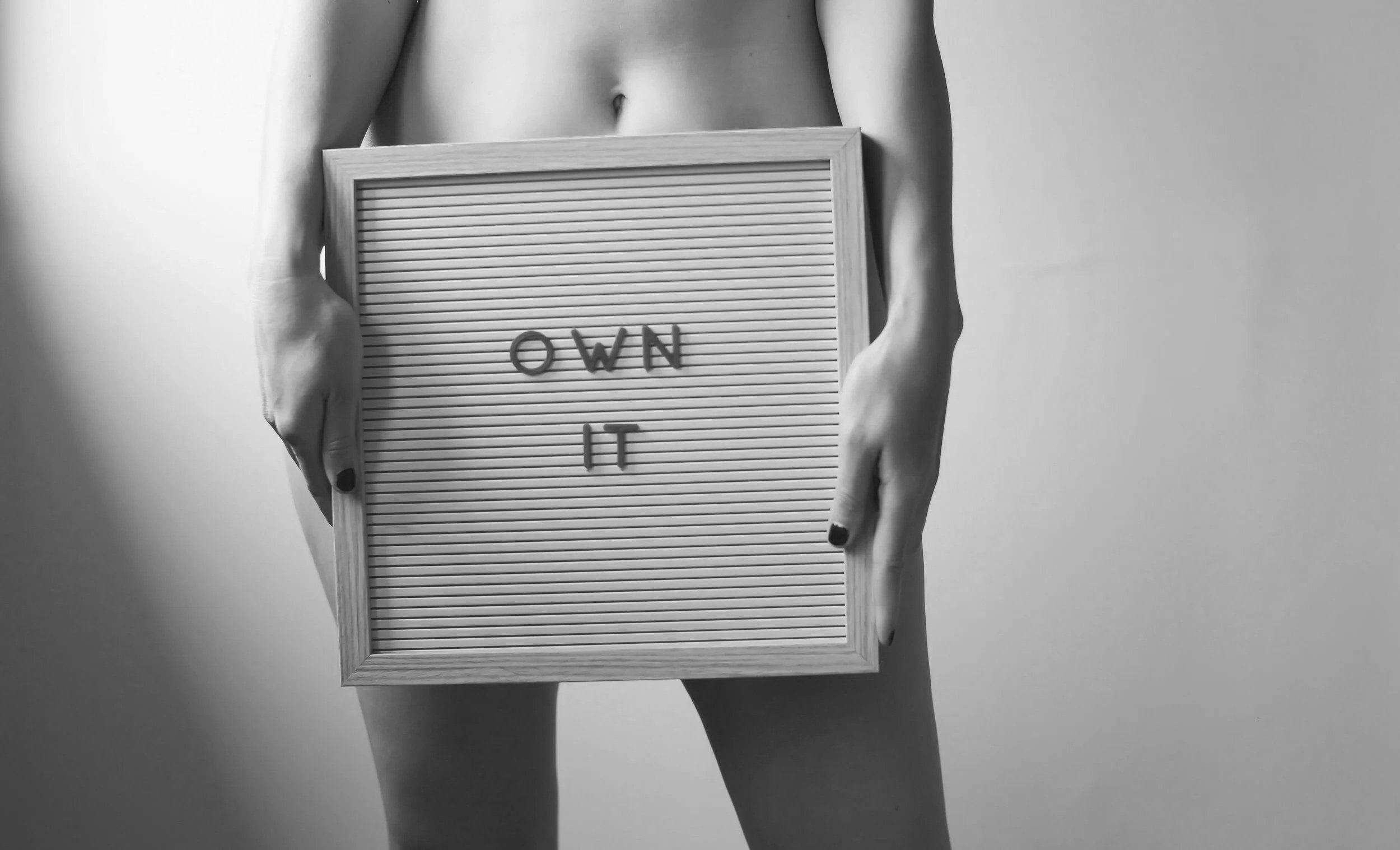 Black and white image symbolising confidence, ownership, and sexual self-acceptance.
