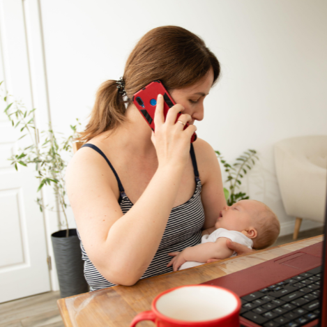 Woman with young baby during a virtual lactation or sleep consultation.