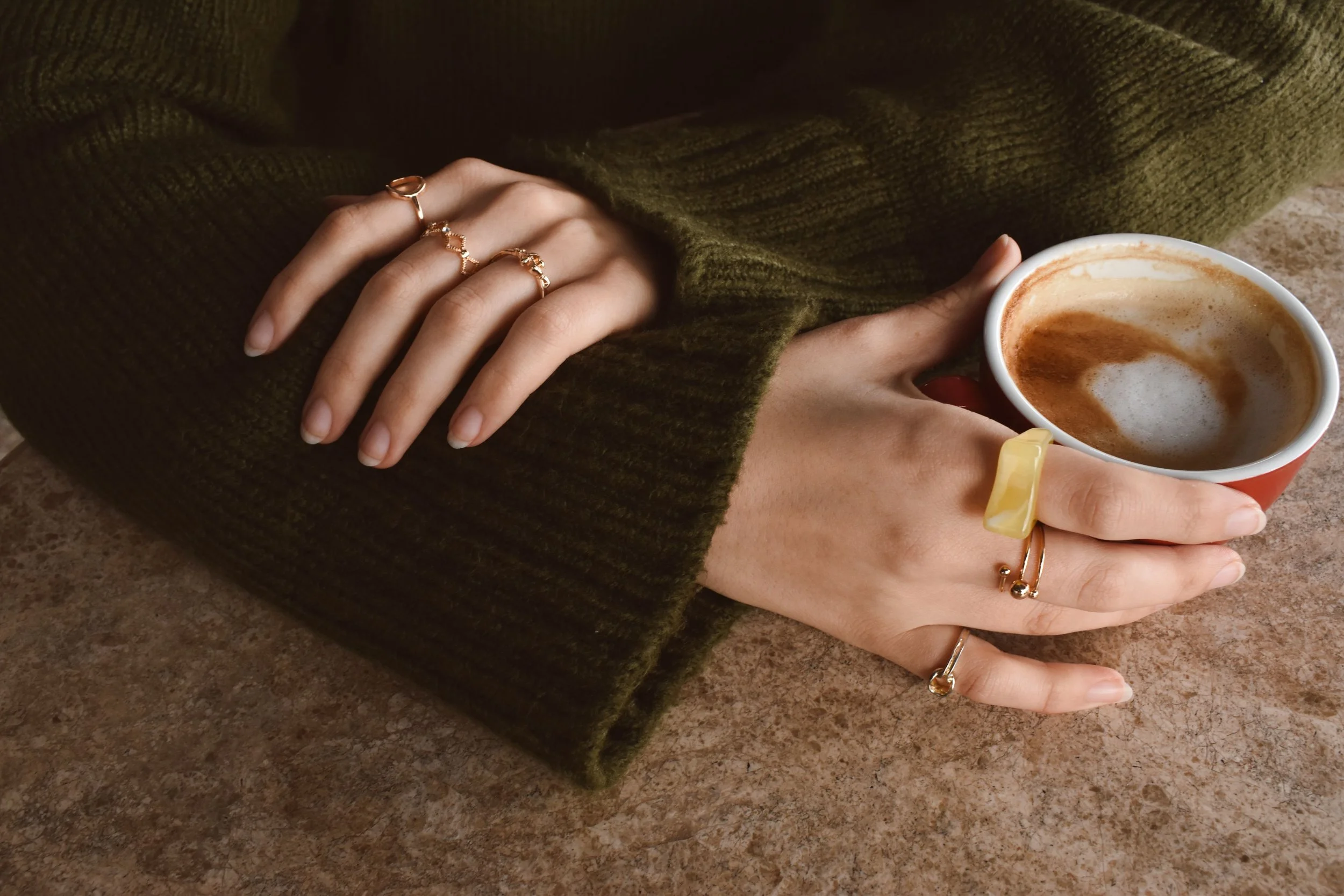 hands holding warm mug representing Jewish therapy for anxiety New York City