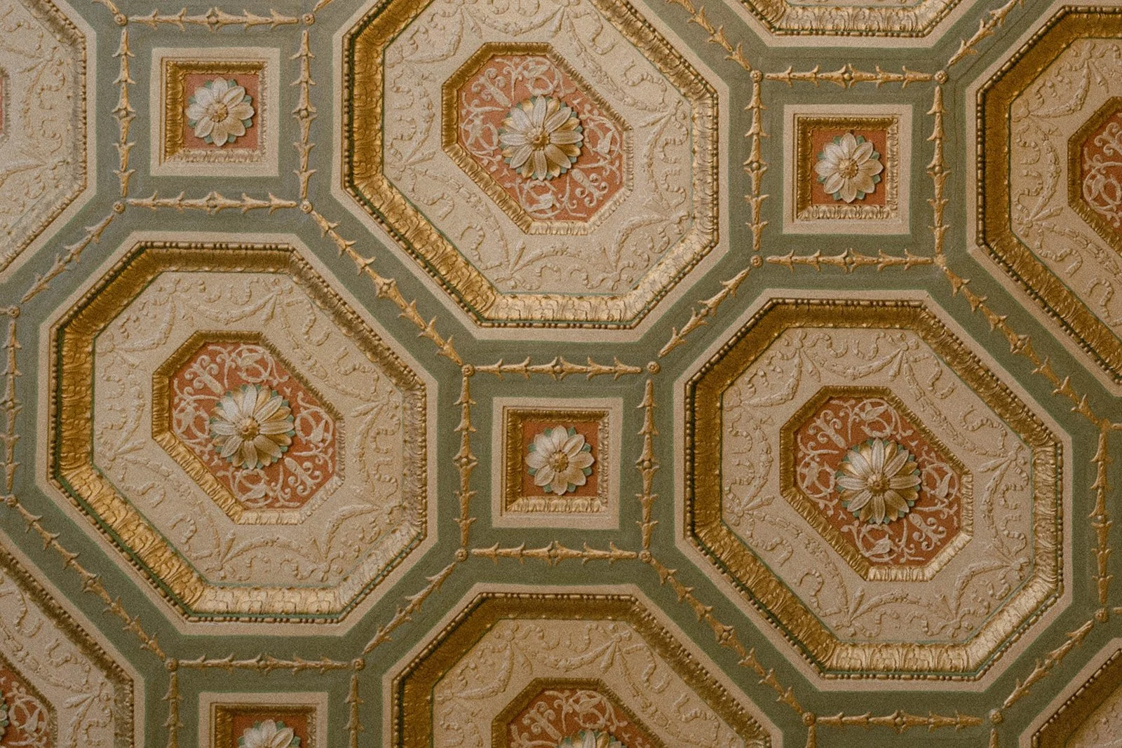 Ornate ceiling with cream, gold and green paint work