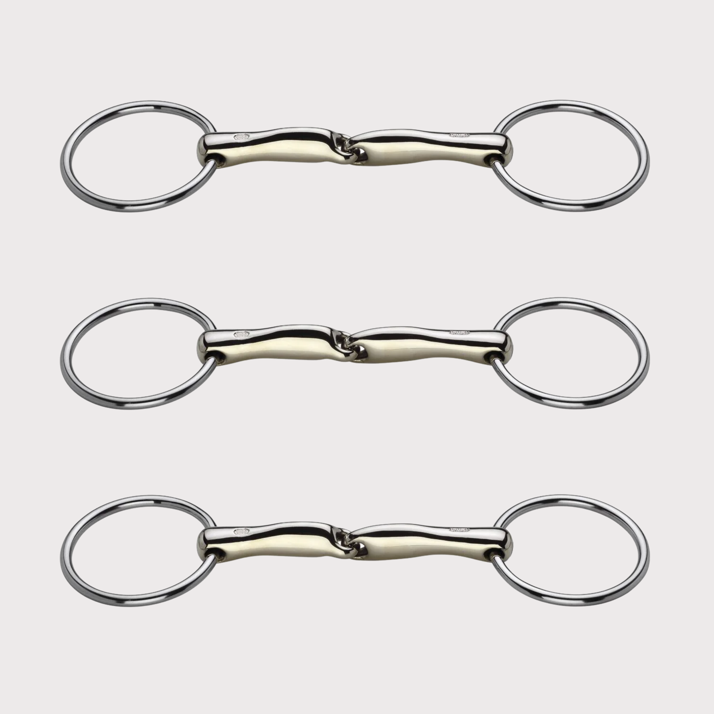 Three metal horse bits arranged vertically on a light background.