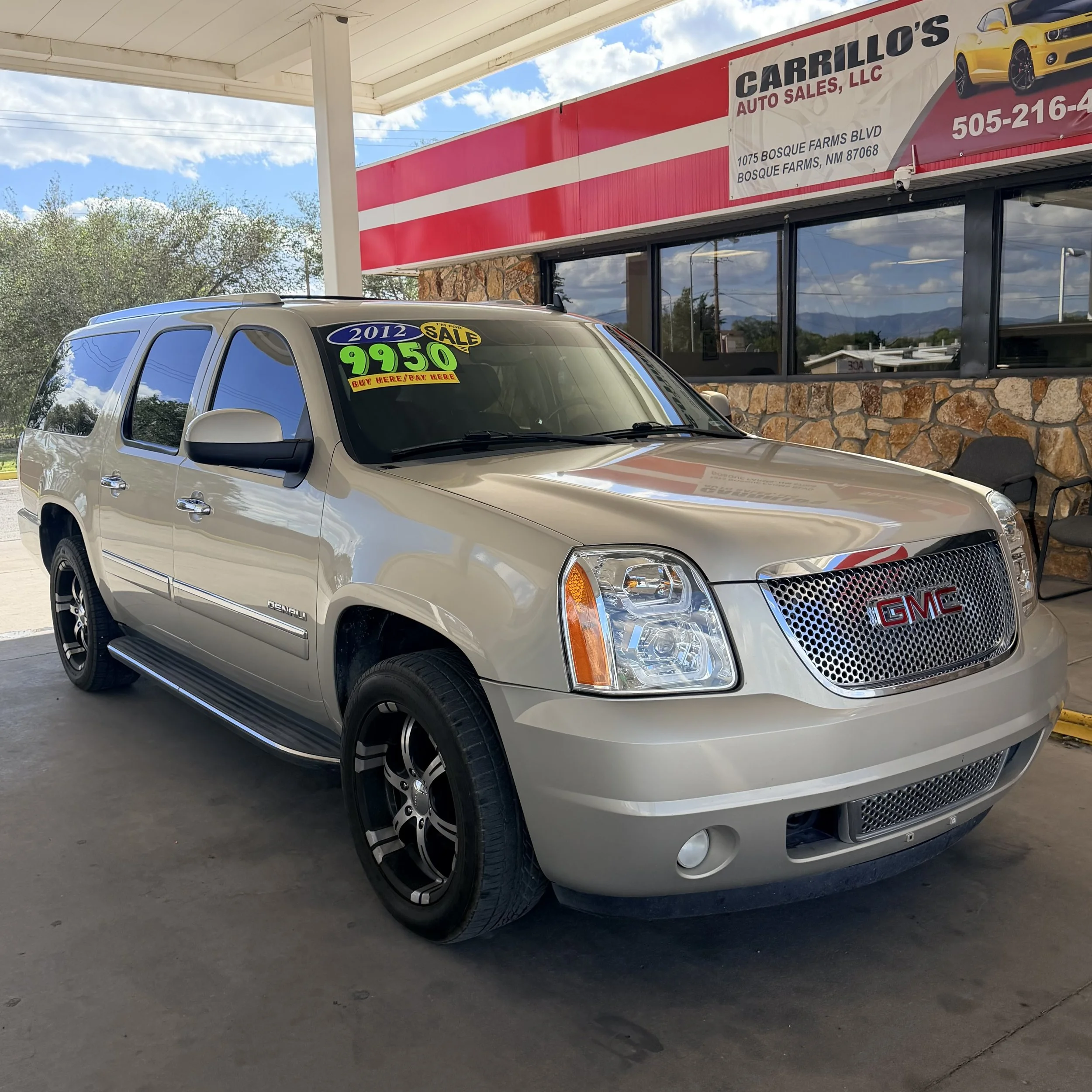 Gold 2012 GMC Yukon XL (140,405 miles) $9,950