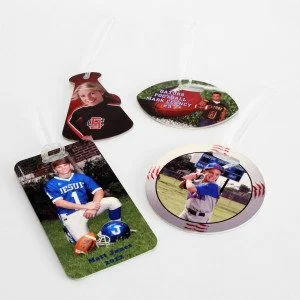 Four circular sports-themed buttons featuring children and sports scenes, arranged on a white surface.