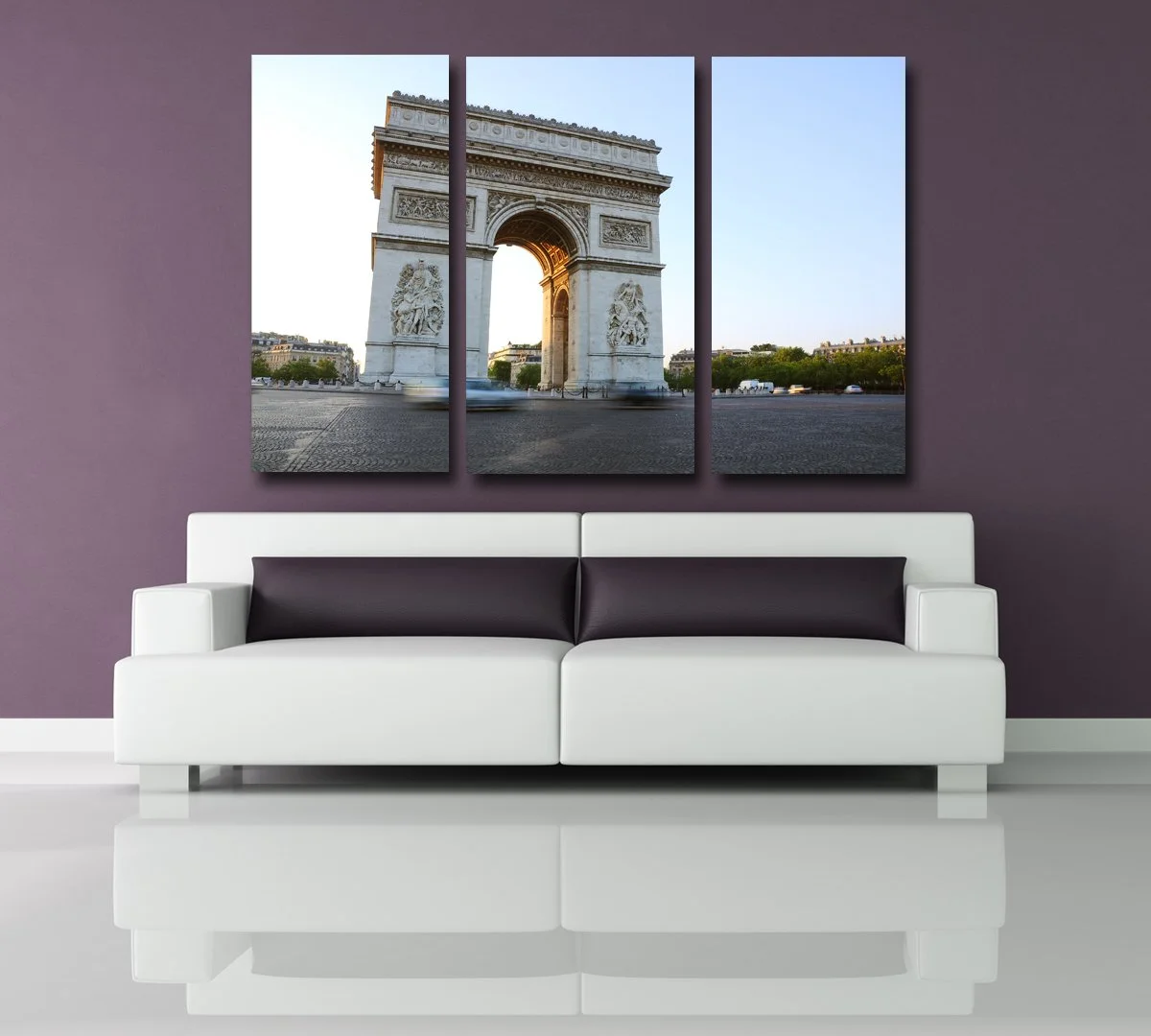 Living room with a white sofa on a shiny floor, purple wall, and a triptych of the Arc de Triomphe hanging above the sofa.