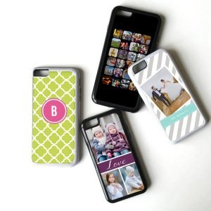 Four portable electronic devices, including smartphones with custom cases, placed on a white surface. One smartphone has a grid of app icons, another displays a photo of two children, and the other two feature decorative designs.