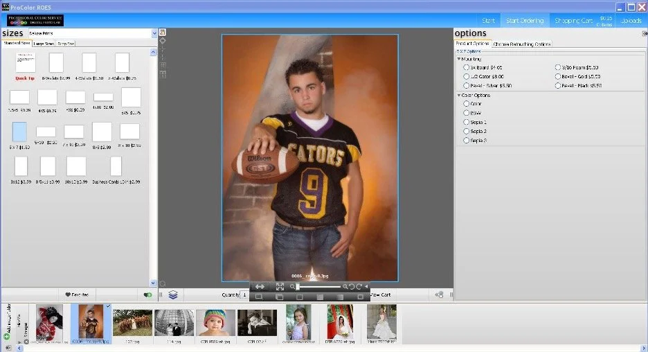 A young boy wearing a football jersey with the number 9 and the word 'GATORS', holding a football, standing in front of a painted backdrop showing an indoor scene with stairs.