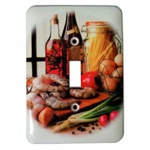 A still life scene with bottles of wine, a jar of spaghetti, eggs in a wire basket, tomatoes, green onions, and garlic on a white surface.