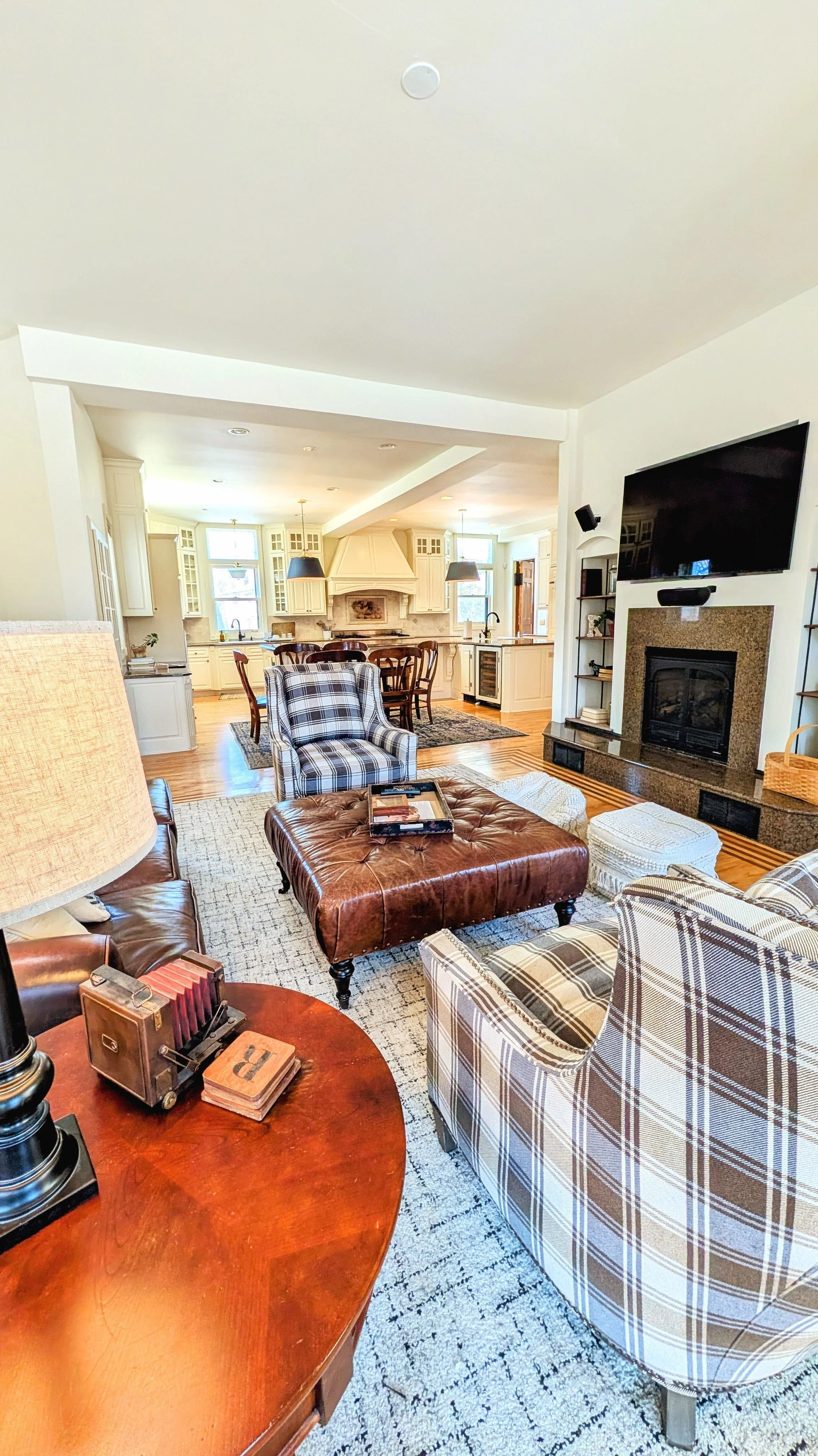 A view of the 1st Floor Family room at the Moore House, looking into the kitchen