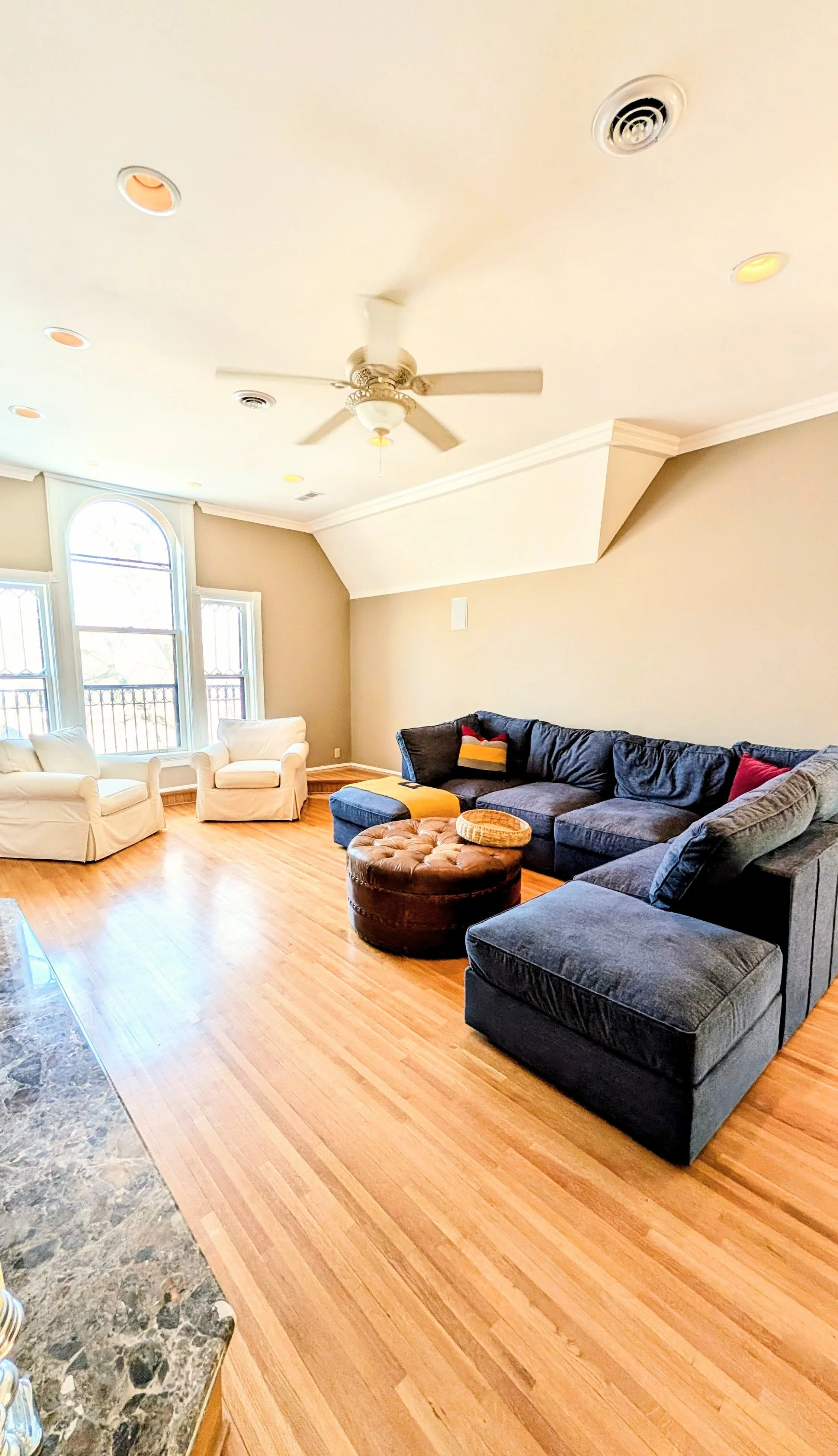 A view into the 3rd floor family room at the Moore House, featuring the iconic windows that would have been in Mary Richards apartment on the Mary Tyler Moore Show