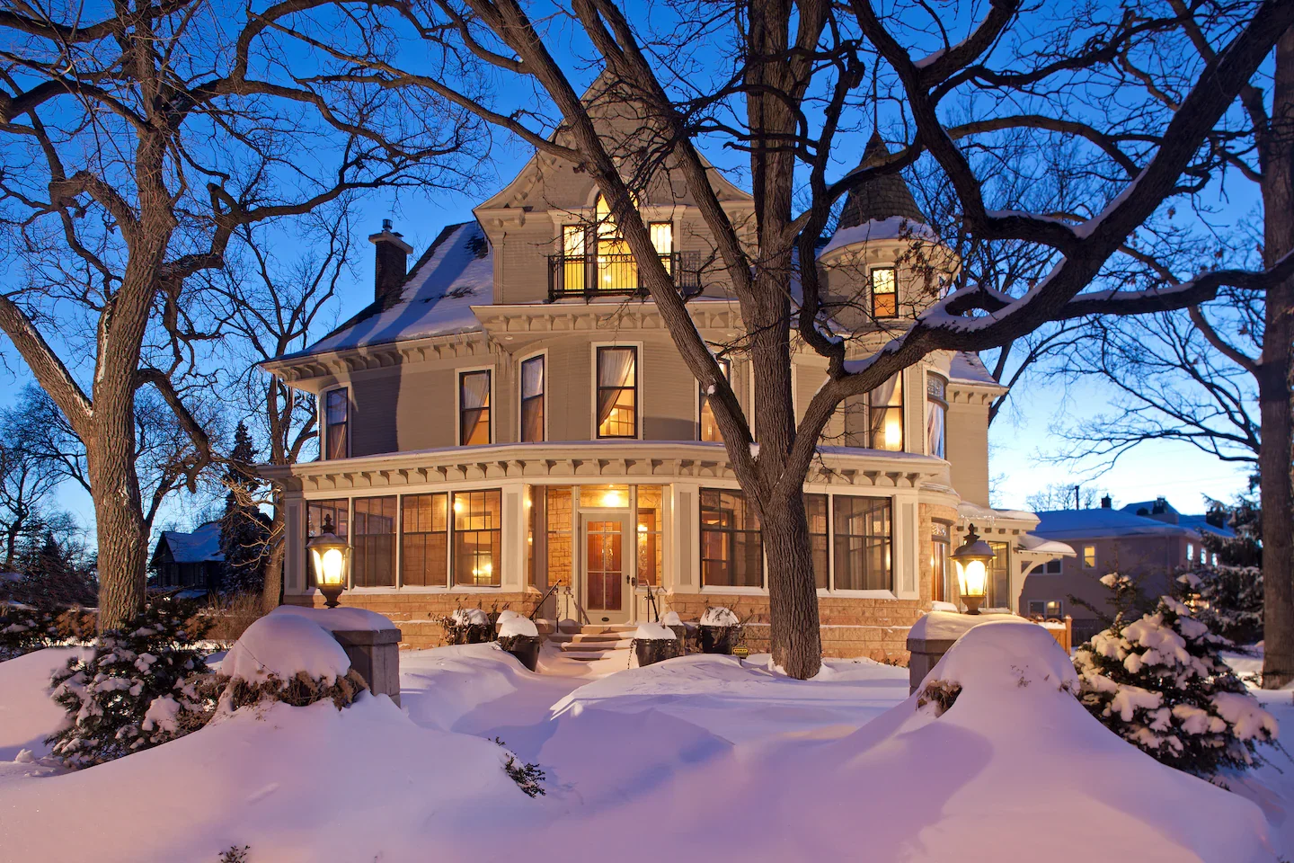 A scene of the iconic Moore House exterior during a winter evening.