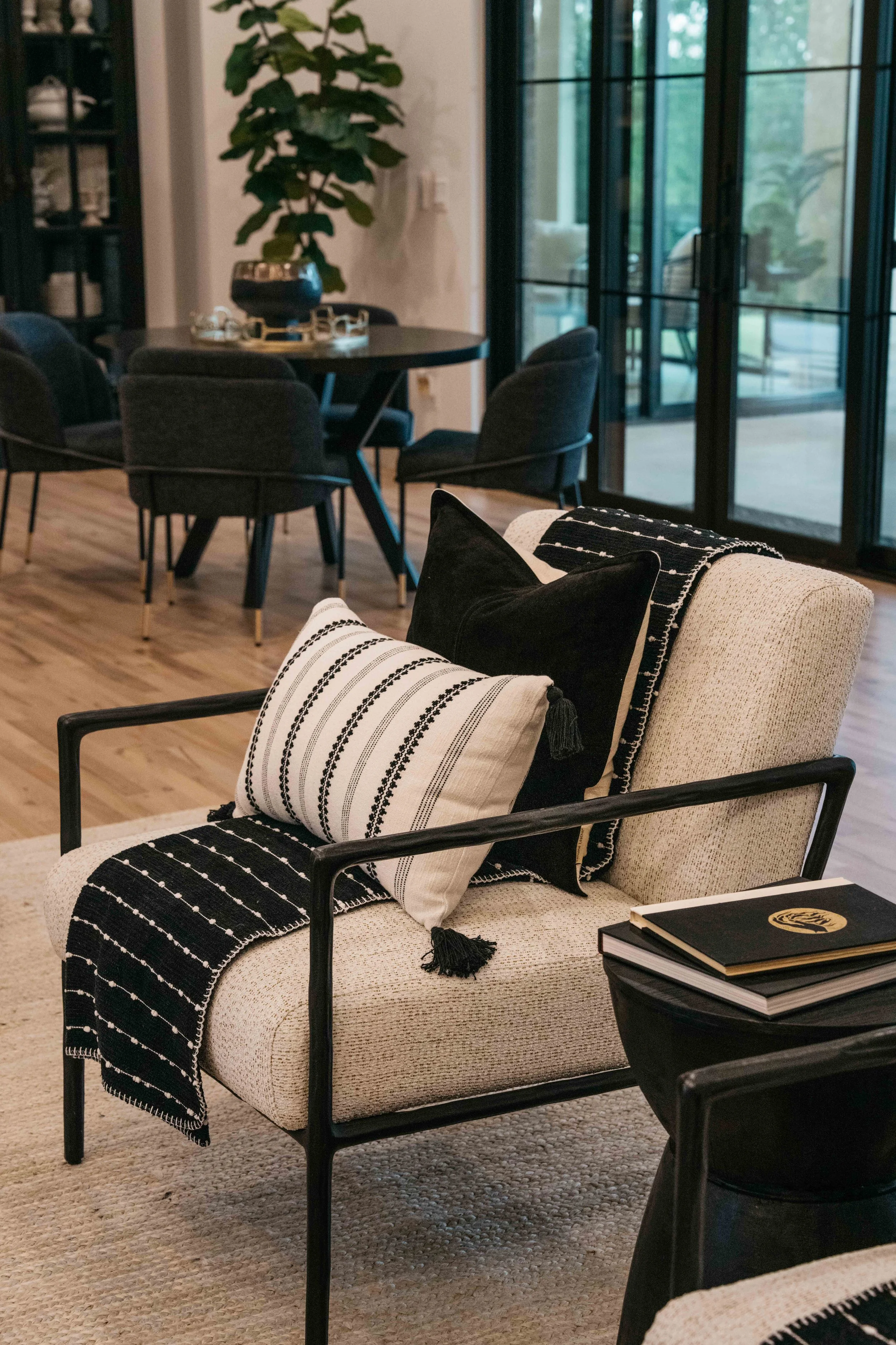 Custom-designed lounge seating with textured upholstery, layered pillows, and refined modern detailing.