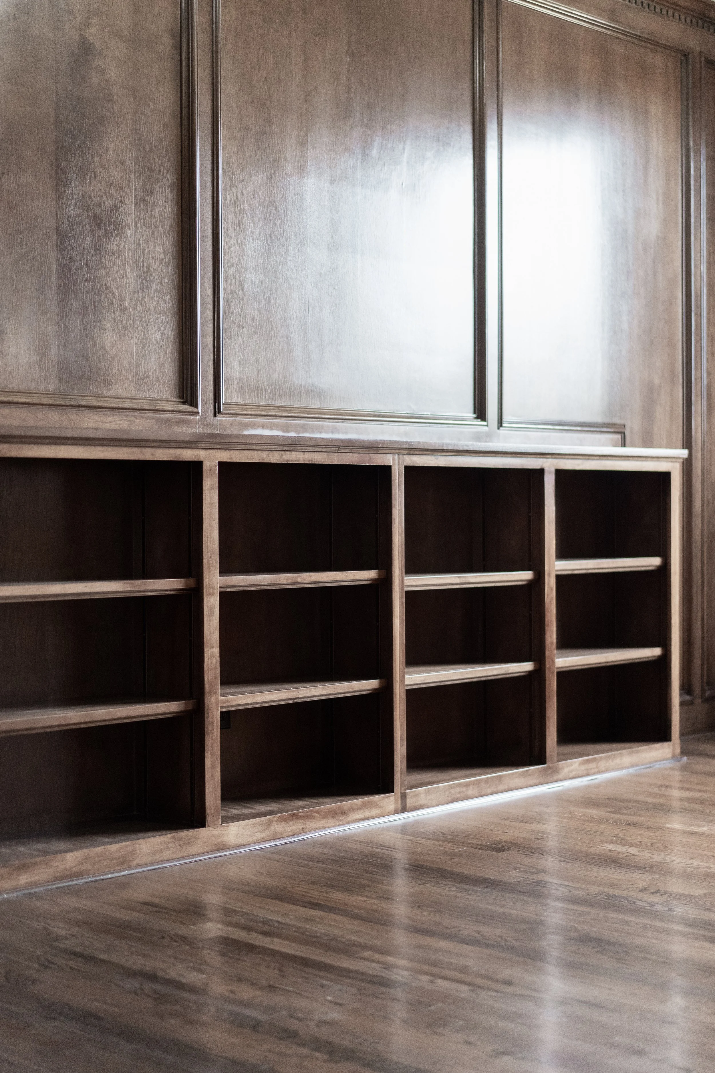Handcrafted custom built-in cabinetry showcasing warm wood finishes and tailored storage.