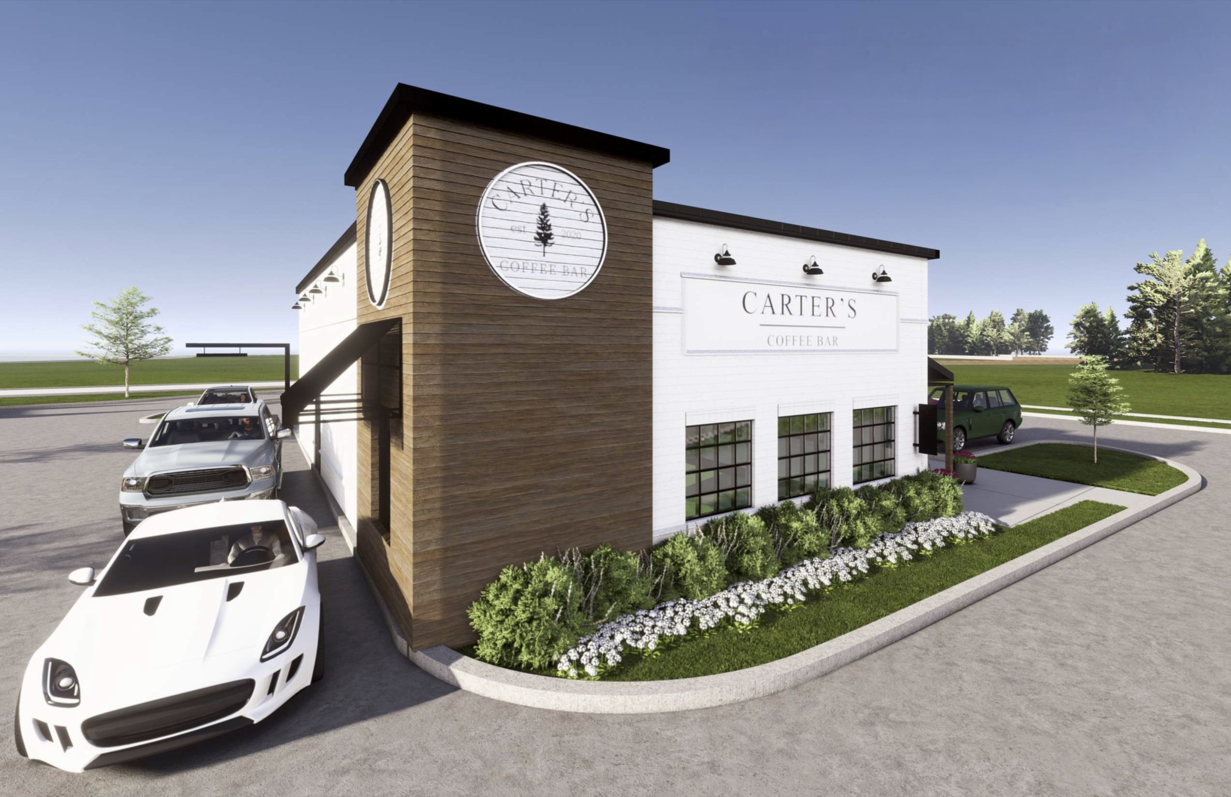 Front view of Carter's Coffee Bar building with cars parked nearby, surrounded by a landscaped area with bushes and trees.