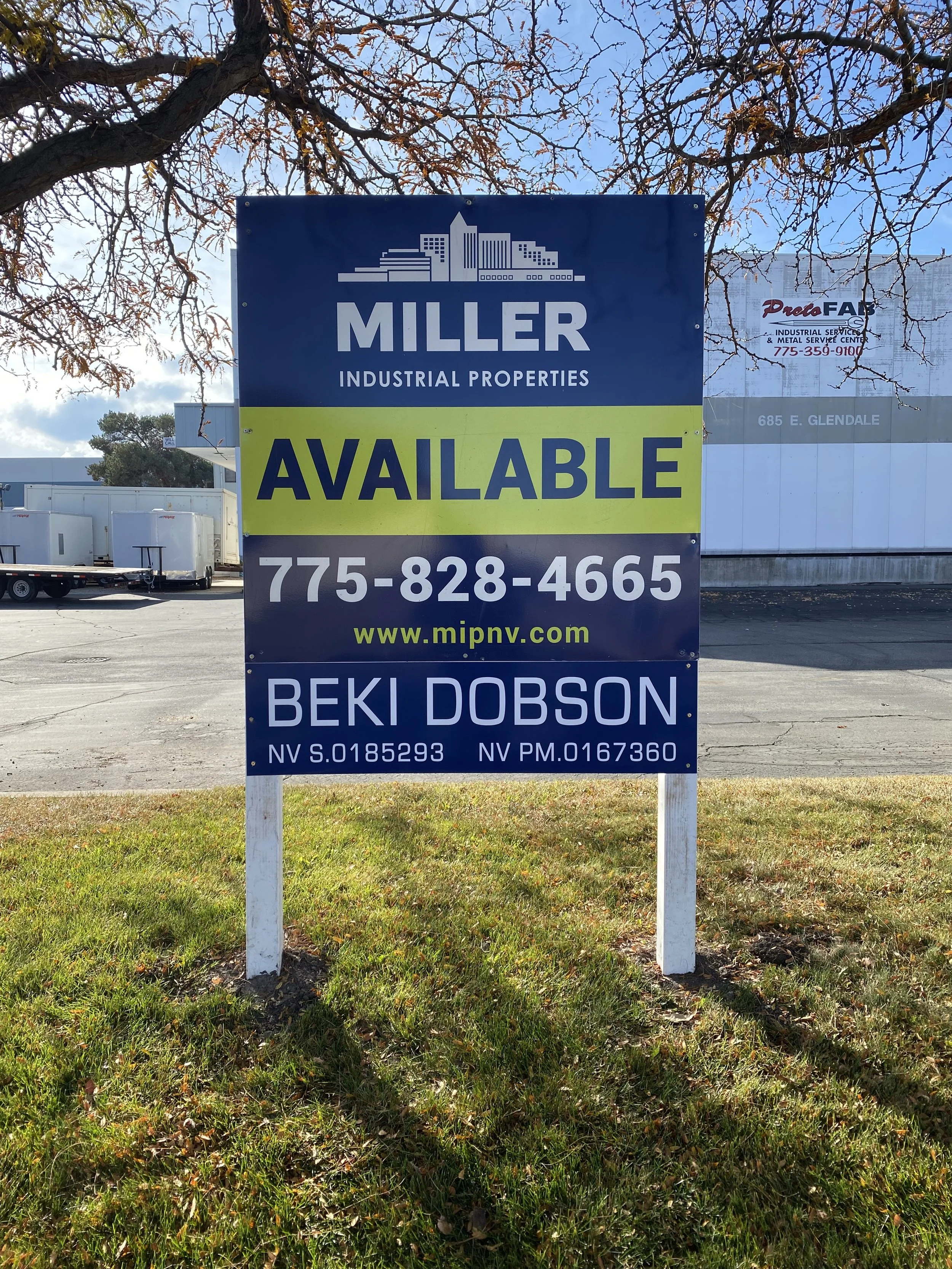 Signboard advertising available commercial properties from Miller Industrial Properties with contact number 775-828-4665 and website www.mipnv.com, with the name Beki Dobson.