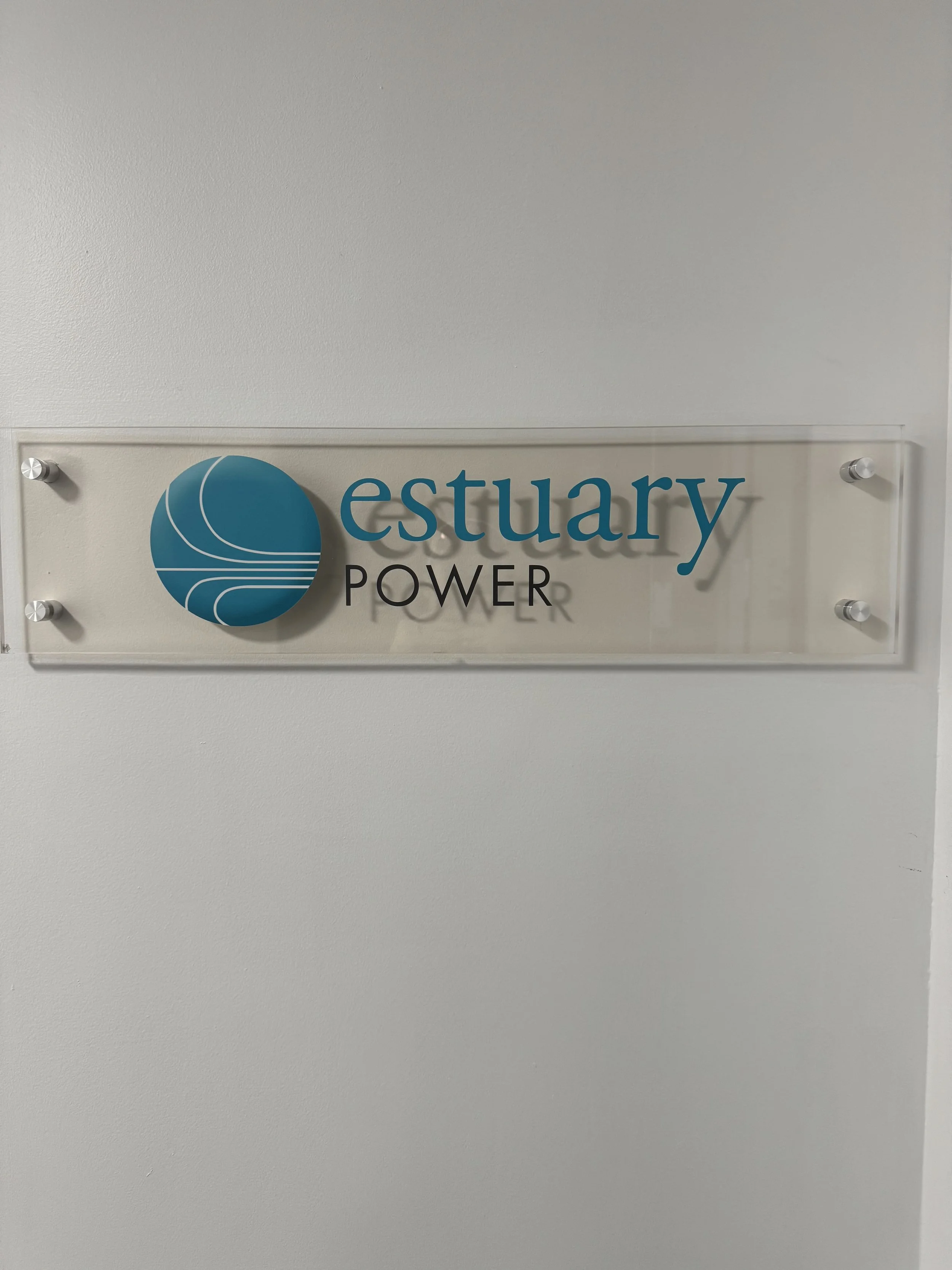 Sign for estuary power on a wall.