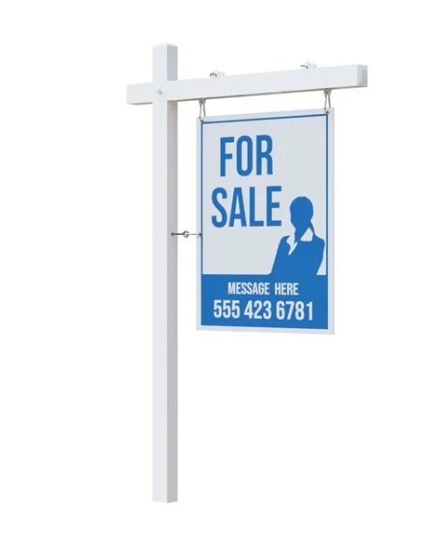 A sign hanging from a white wooden post that says "For Sale" in large blue letters, with a silhouette of a person and a phone number below.