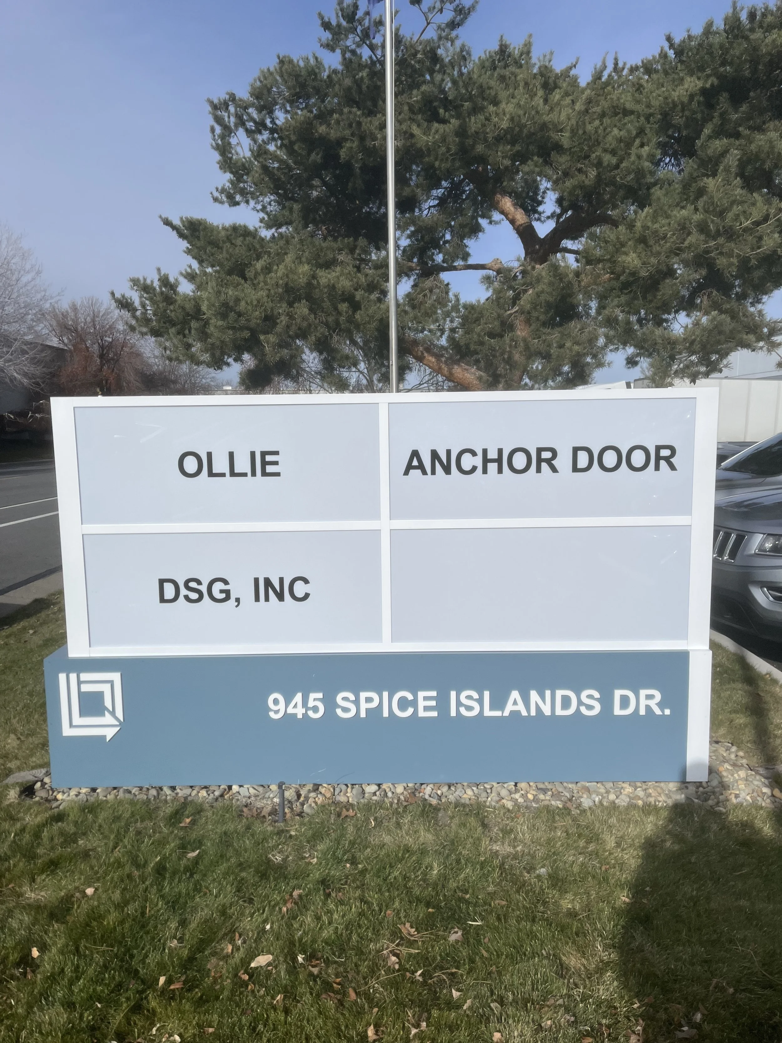 Sign at 945 Spice Islands Drive listing tenants Ollie, Anchor Door, DSG, Inc.