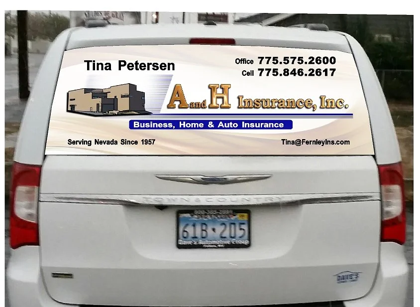 Rear of a white vehicle with an advertisement for A and H Insurance, Inc. on the back window, including contact information and services offered.