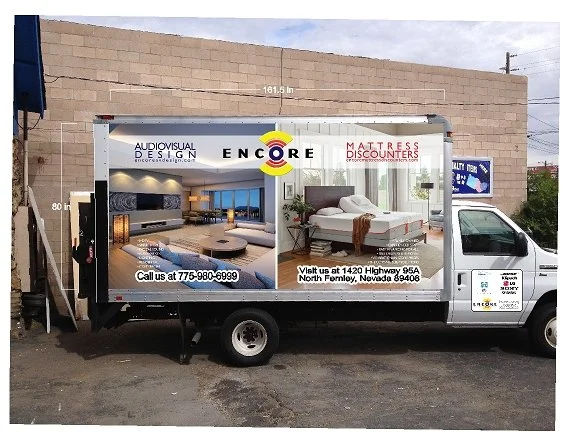 Mobile billboard advertising interior design and mattress store, with contact phone number and store address in North Fremont, Nevada.