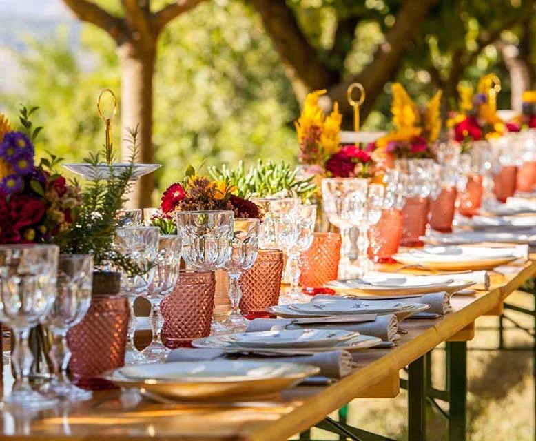 Table dressed for a private meal in an orchard