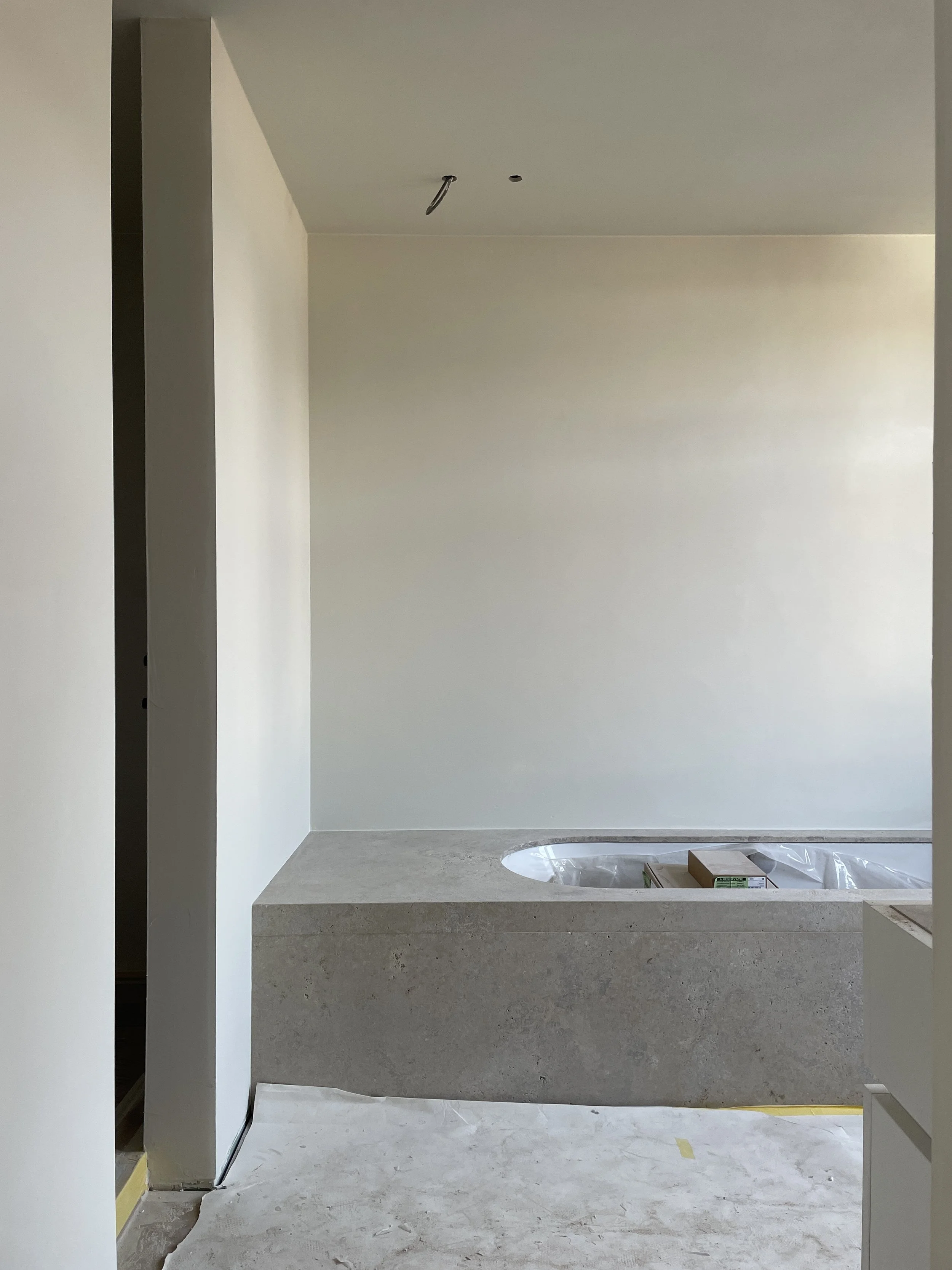 Bureau Destadsbader interior architecture high-end townhouse design, bathroom, travertine bath