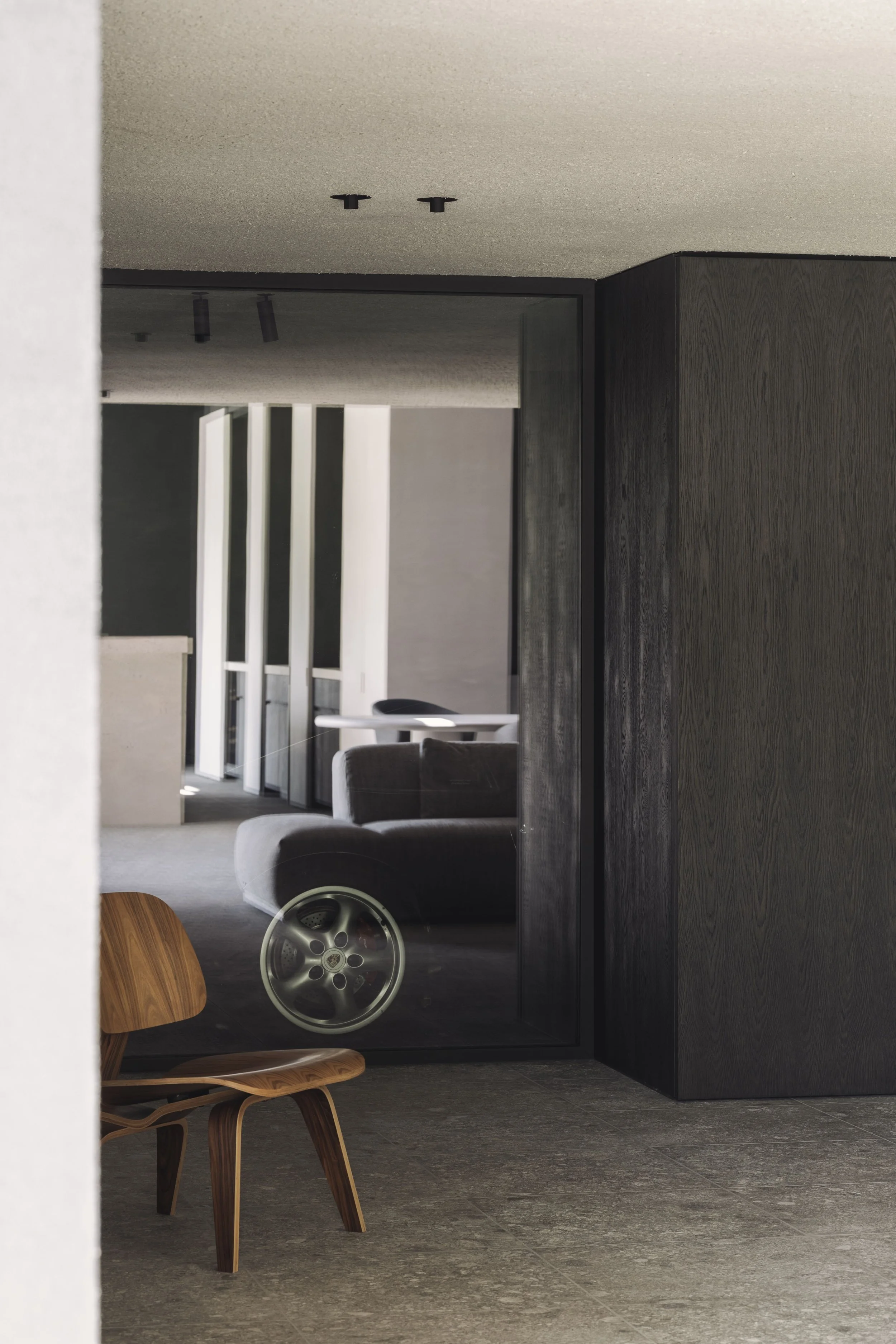 Bureau Destadsbader interior architecture high-end poolhouse design, interior shot garage, porsche