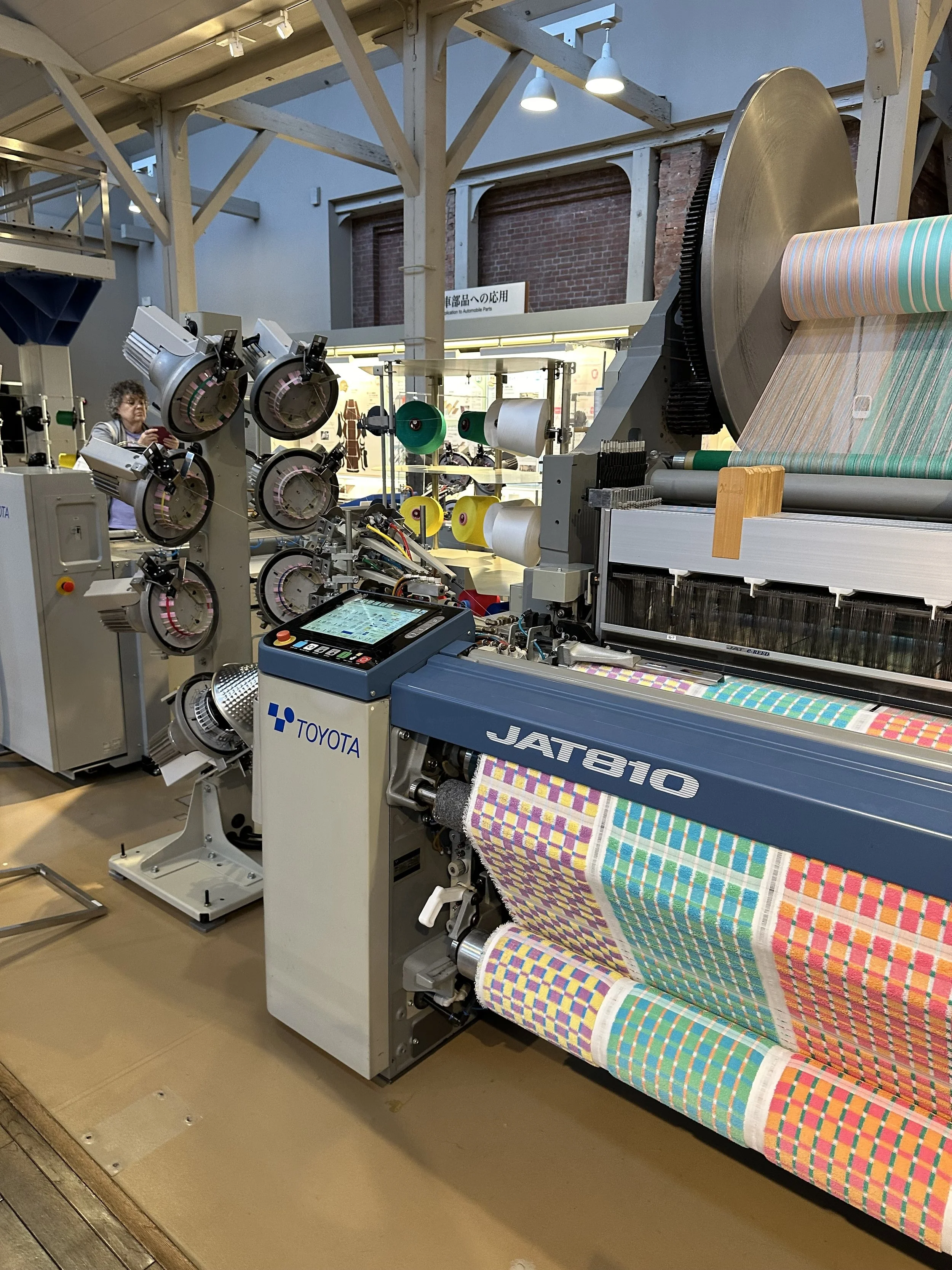 A modern loom at the Toyota factory is on display.