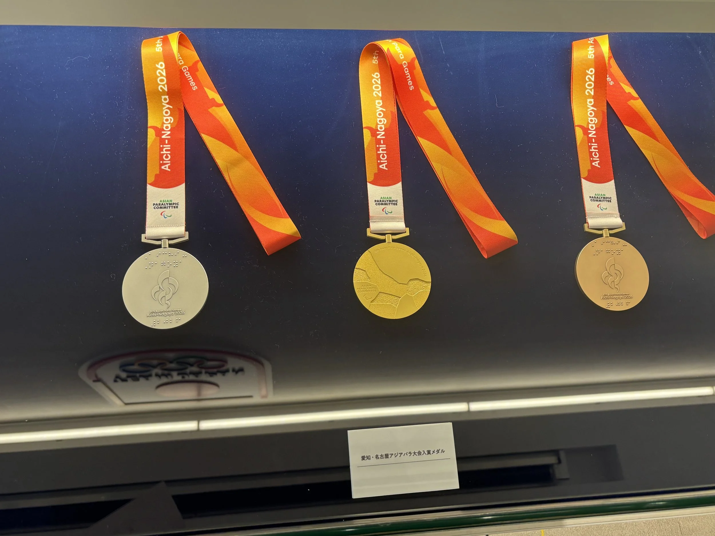 Three metals fro the 2026 Asian Paralympic competition Aichi-nagoya games on display.