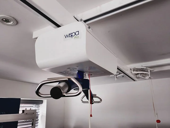 A Wispa ceiling hoist system installed to assist with safe patient transfers.