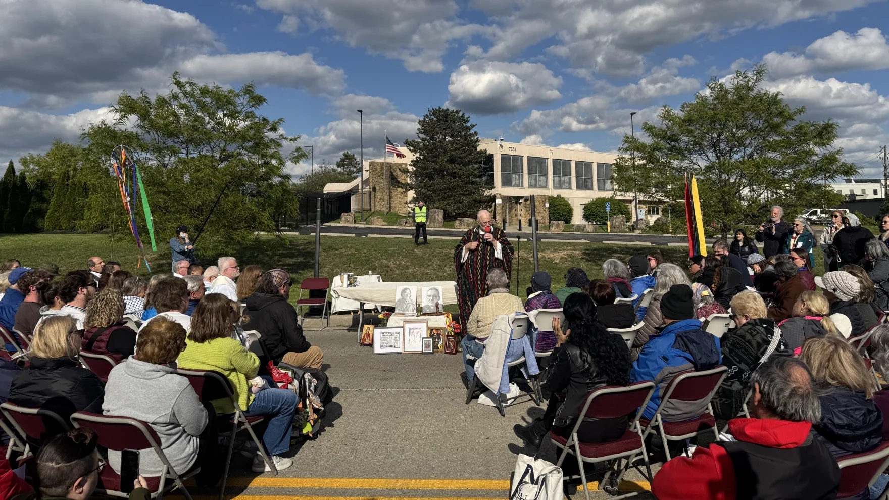 Hundreds hold Mass in the street outside ICE office in Indianapolis