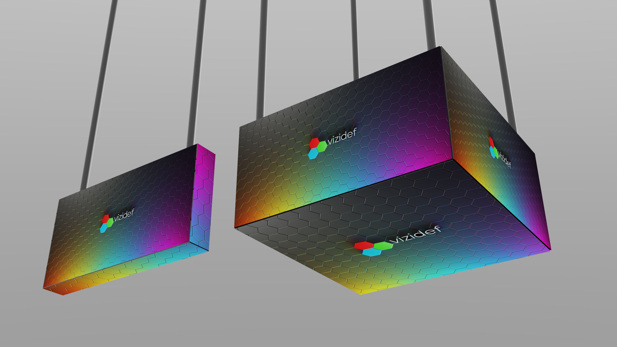 Colorful rectangular and cubic panels with a hexagonal pattern and the Vizidef logo hanging from ceiling.