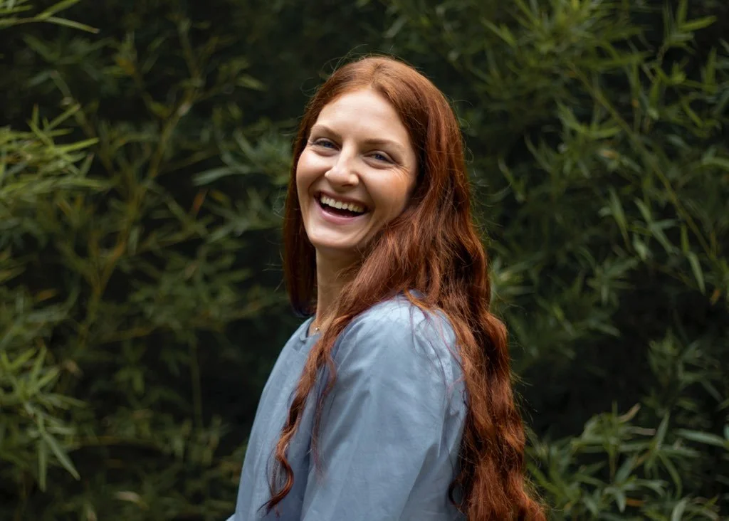 red haired woman with a smile, the owner, Allissa
