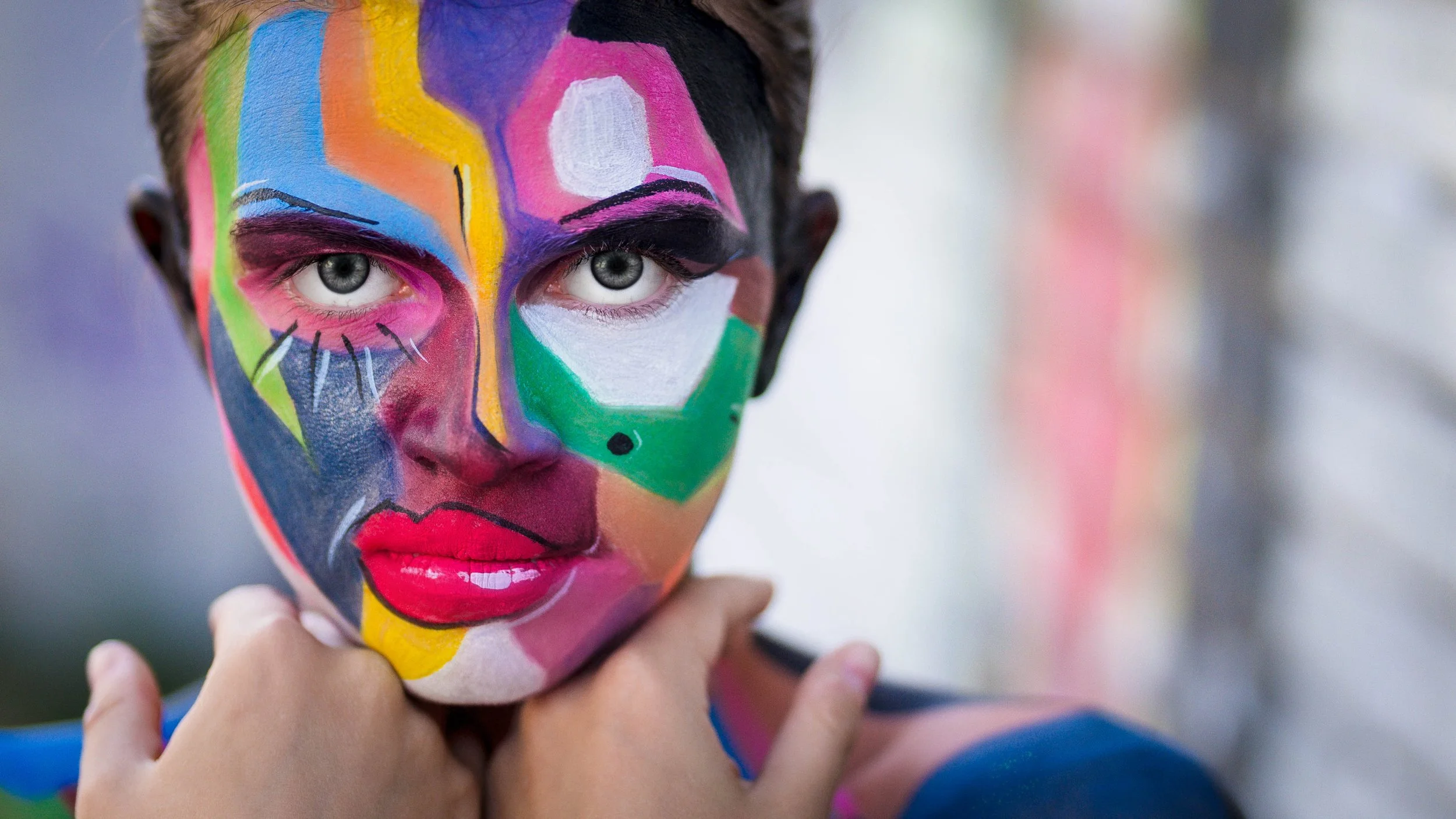 Creative cinematic portrait featuring intricate body painting and professional studio lighting.