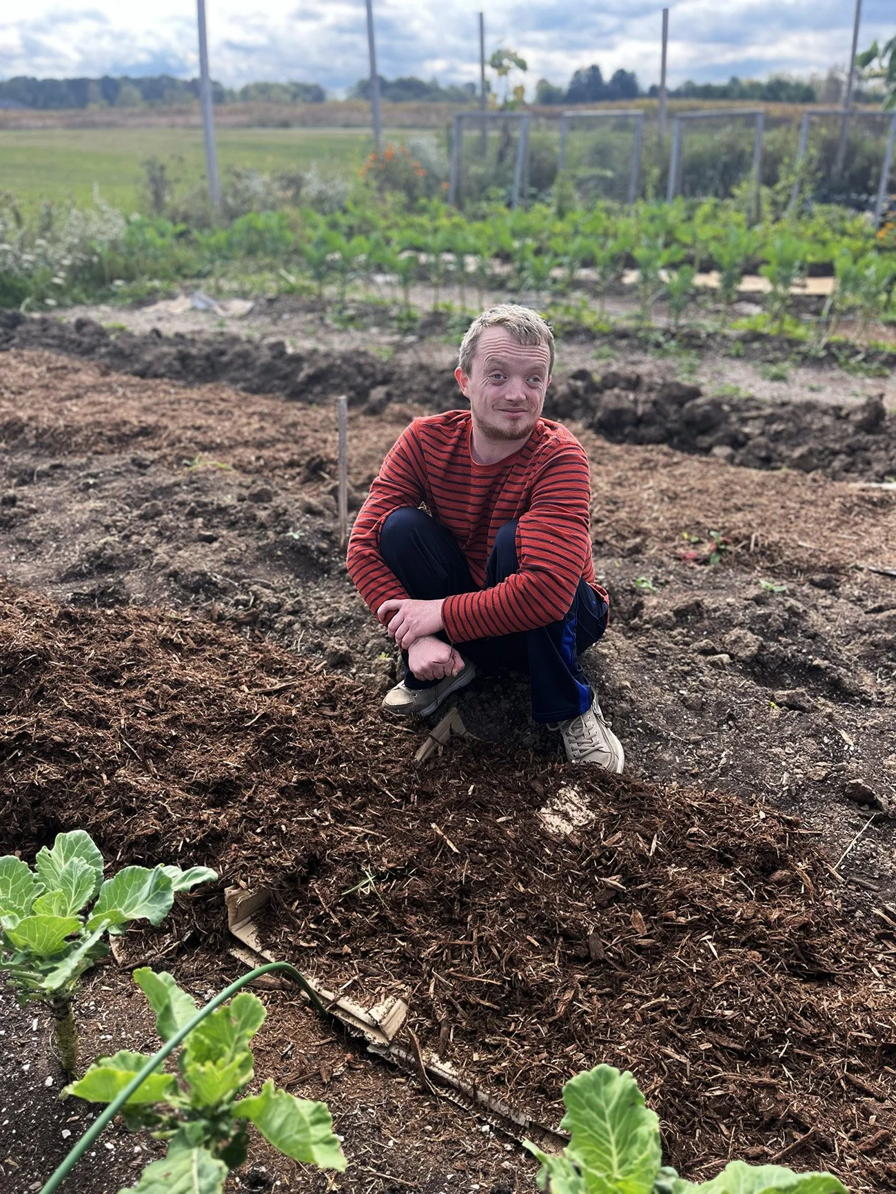 Person with IDD gardening