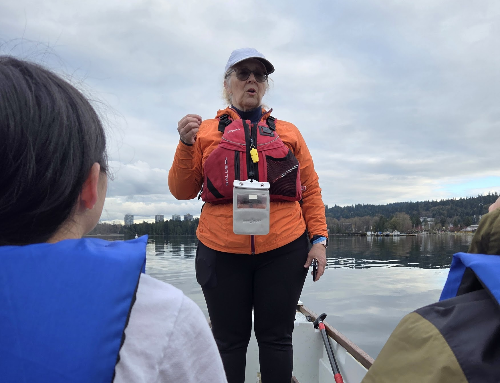 Coach providing instruction from front of the boat